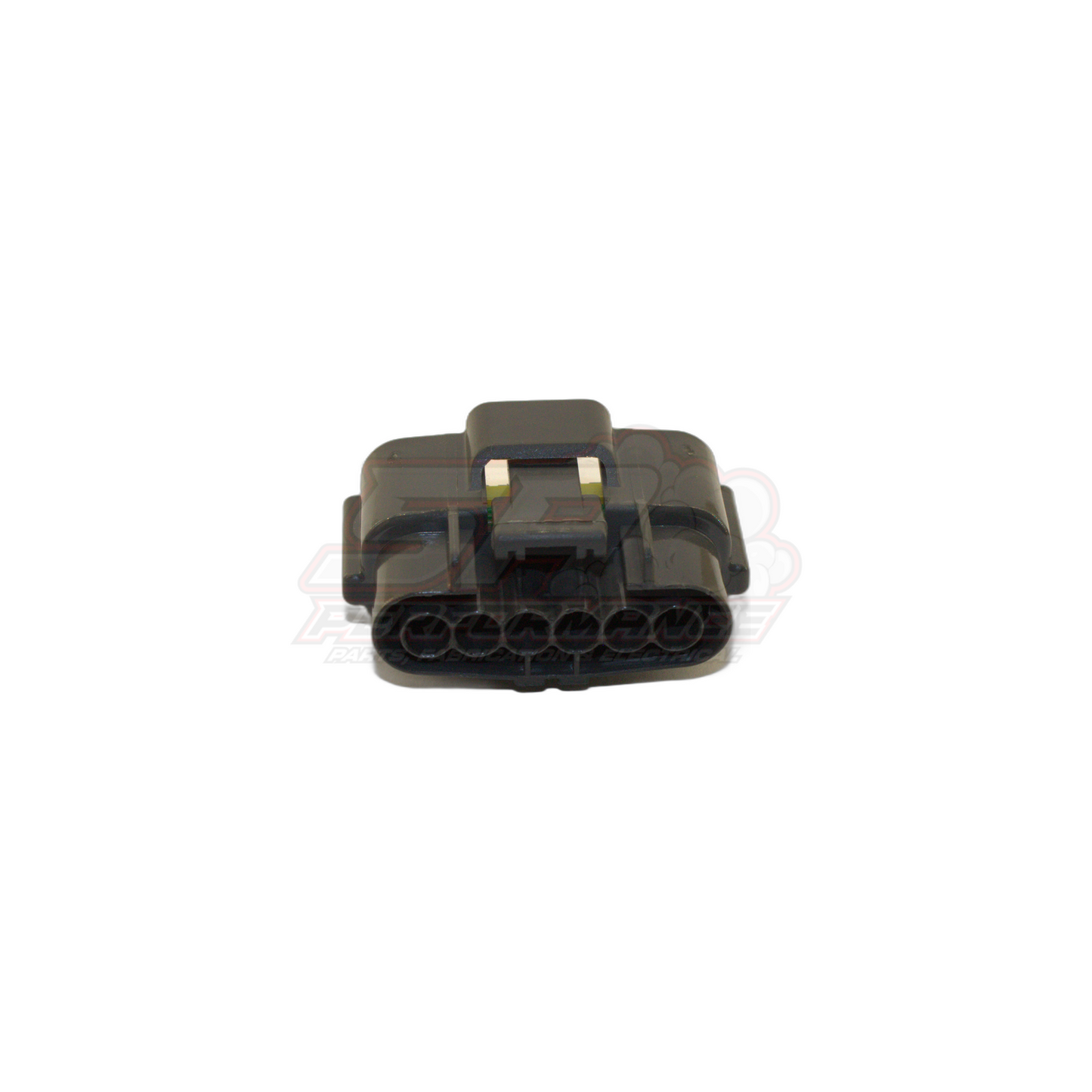 Angled top view of Nissan 6-pin grey igniter connector housing showing six terminal cavities and locking tab with brass terminals visible