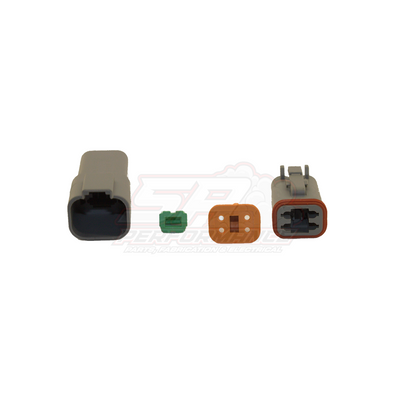 Deutsch DT 4-pin connector kit showing grey male housing, grey female housing with orange wedge lock, green band terminal and brown wedge seal laid out separately