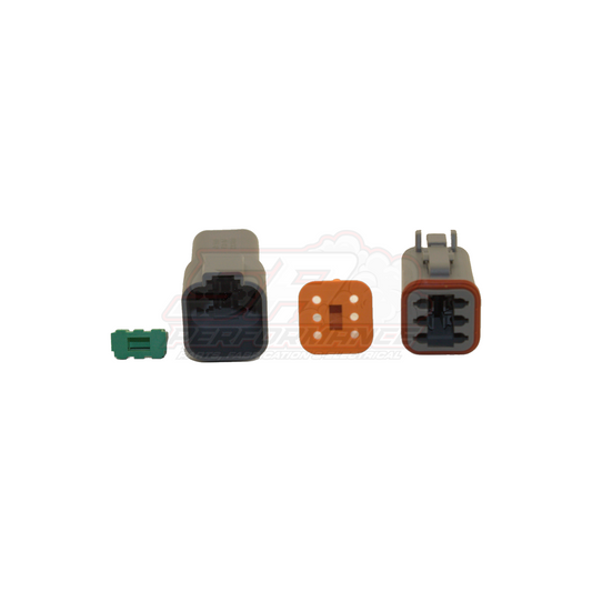 Deutsch DT 6 pin connector kit components showing male and female grey housings with orange seal, green band terminal and wedge lock on white background