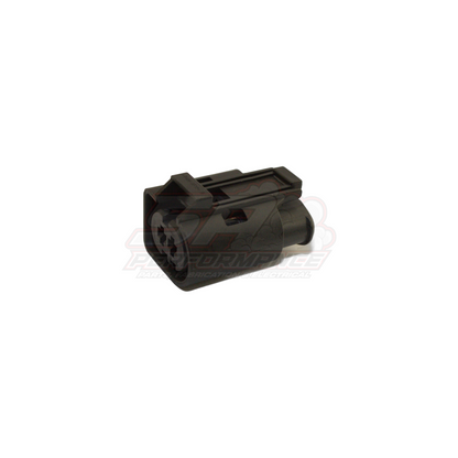 Black 2-pin Bosch Euro-style connector housing angled view showing terminal cavity slots and locking tab