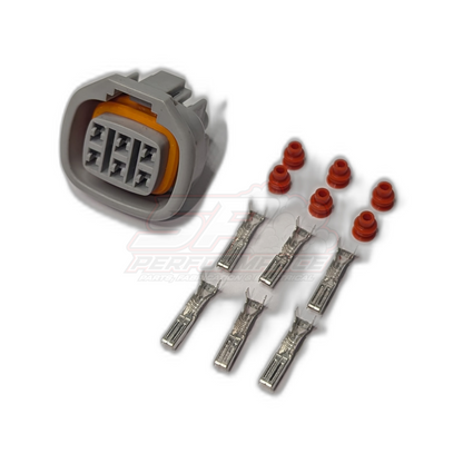 Denso 6 pin connector kit exploded view showing grey housing with orange seal, six metal terminals and red seals for throttle pedal and idle speed motor