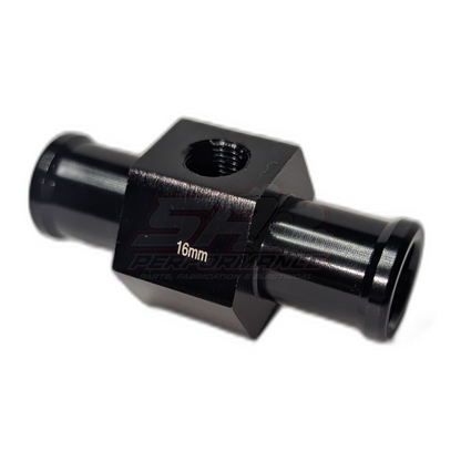 Black anodised aluminium 16mm coolant hose adapter with 1/8 NPT sensor port, angled view showing hexagonal body and barbed hose inlets