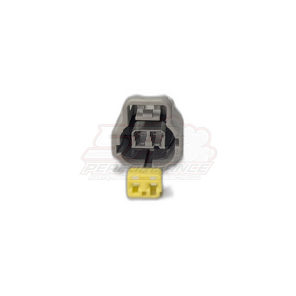 Grey 2-pin Toyota ECT connector housing with yellow female plug end, front view showing terminal cavities and locking tab