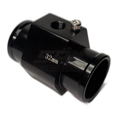 Black anodised aluminium 32mm coolant hose adapter with 1/8 NPT sensor port and mounting grub screw, angled view showing threaded inlet and hose barb outlets