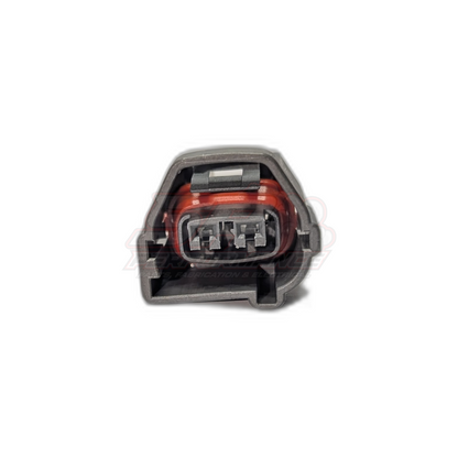 Front view of Toyota 1JZ-GTE 2JZ-GTE 2-pin cam crank sensor connector housing showing grey shell with red seal and metal terminals