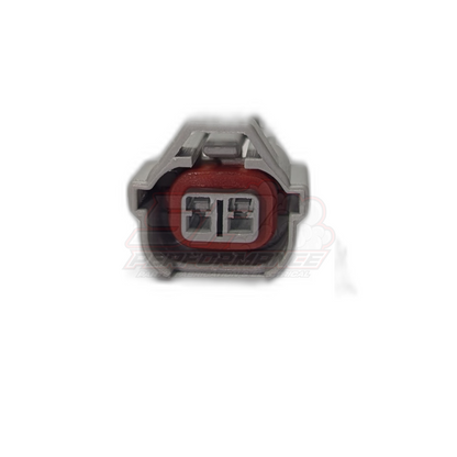 Front view of 2-pin Denso high guide injector connector showing grey housing with red seal and dual terminal slots