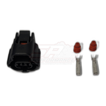Toyota 2-pin IAT sensor connector kit showing black housing, two silver female terminals and red rubber seals laid out individually