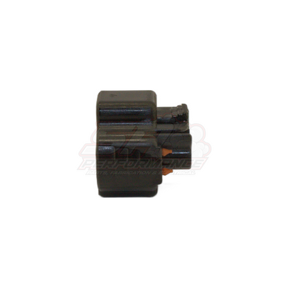 Denso 3-pin connector housing side view showing black plastic body with orange copper terminals and locking tab