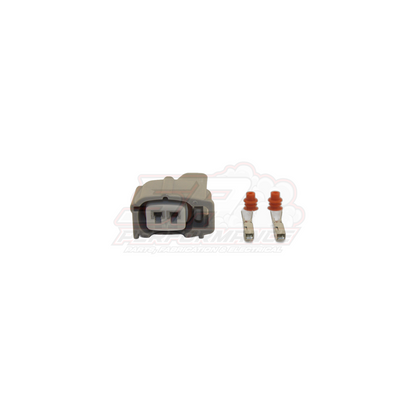 Grey Denso 2-pin injector connector housing with two gold crimp terminals and red rubber seals for Nissan Toyota Mitsubishi