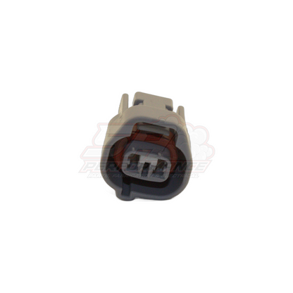 Front angled view of 2-pin Denso left guide connector housing in grey with brown seal and visible terminal slots