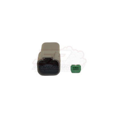 Deutsch DT04-4P 4-pin female housing in grey with black rubber seal and green wedge lock shown separated