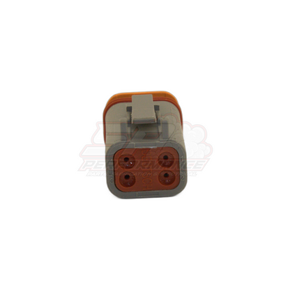 Front view of Deutsch DT 4-pin male connector DT06-4S showing grey housing with orange sealing edge and brown terminal insert with four contact positions