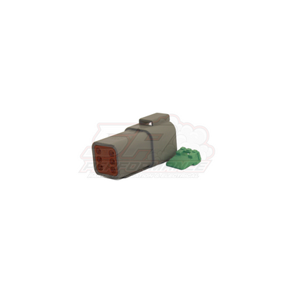 Deutsch DT 6 pin female housing in grey with brown contact face and green wedge lock visible in angled view