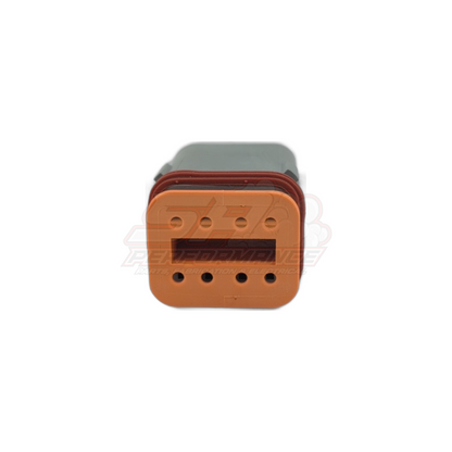 Front view of orange Deutsch DT06-8S(A) 8-pin male housing showing four upper and four lower terminal cavities with red seal and grey wedge lock attached