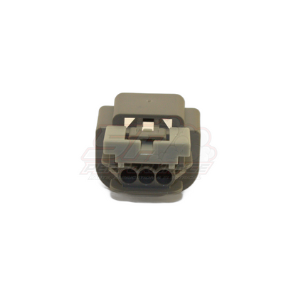 Grey 3-pin female connector housing front view showing three circular terminal cavities and black latch mechanism for E85 flex fuel sensor