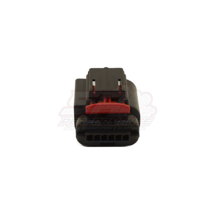 Front view of 6-pin Ford GM throttle body connector showing black housing with red retaining clip and six terminal cavities