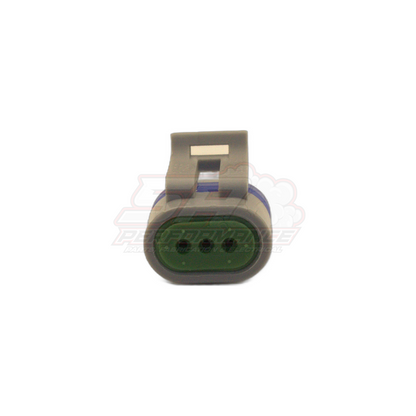 Front view of GM CAS 3-pin connector plug showing grey housing with metal locking tab and green oval seal with three terminal positions for Holden Commodore cam angle sensor