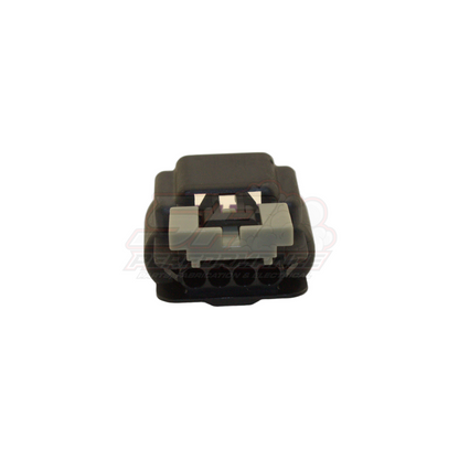 Front view of GM 4-pin black connector housing with grey locking tab and visible terminal cavities for late V6 Commodore coil-on-plug applications