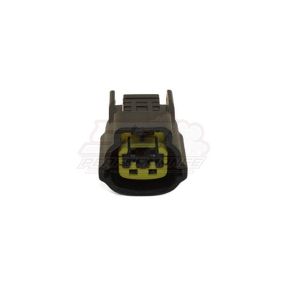 Front view of 2 pin grey Nissan connector showing yellow terminal inserts and retention slots in housing for coolant temp sensor and fuel pump module applications