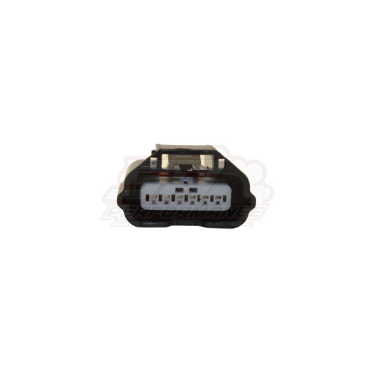 Front view of 6-pin Nissan airflow meter connector showing black housing with white plug insert and visible terminal slots