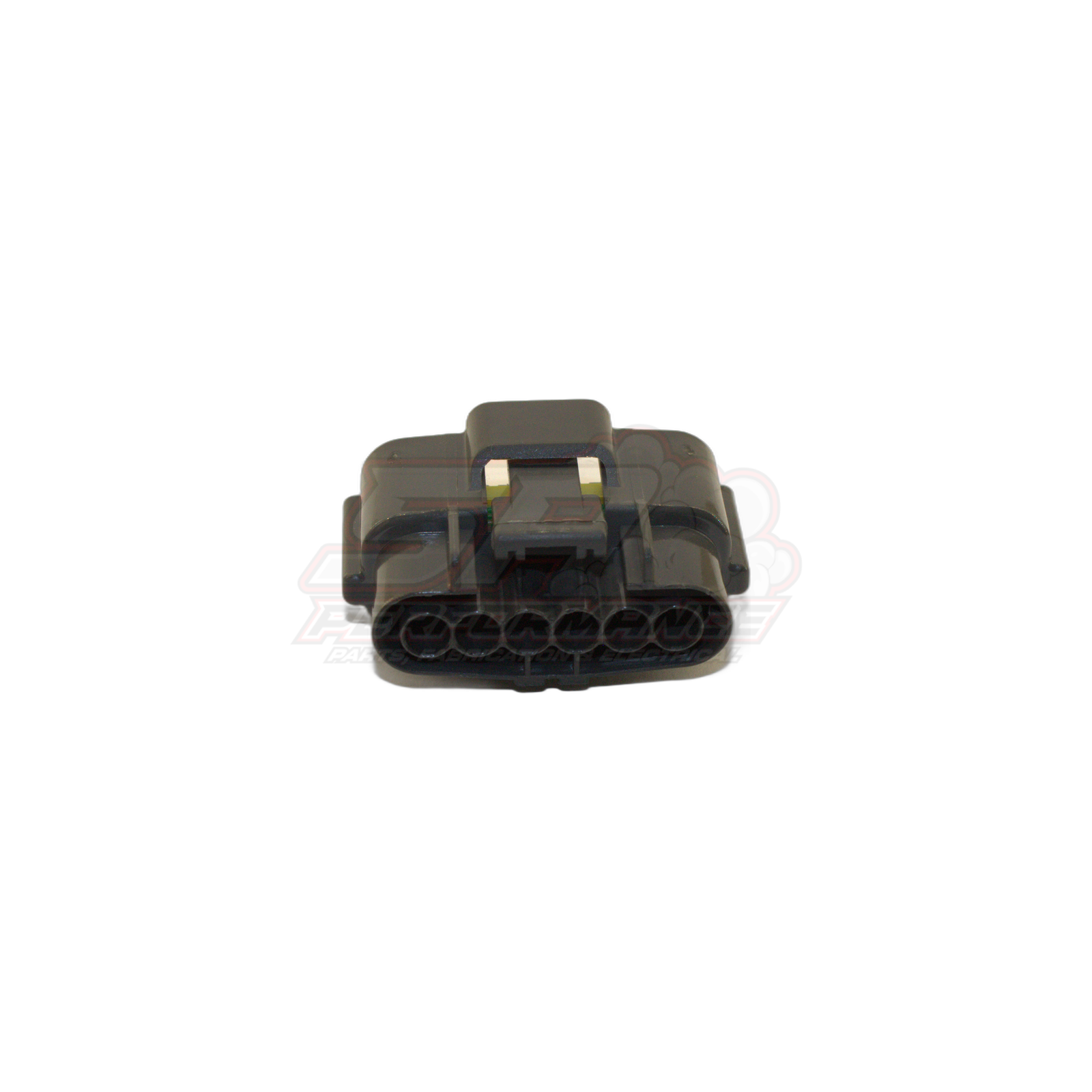 Angled top view of Nissan 6-pin grey igniter connector housing showing six terminal cavities and locking tab with brass terminals visible