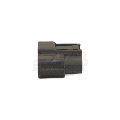 Side view of black 3-pin Nissan ignition coil and TPS connector housing showing ribbed locking tab and pin cavity openings