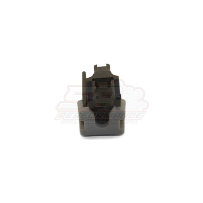 Front view of grey single pin connector housing with black terminal insert for Nissan oil pressure switch