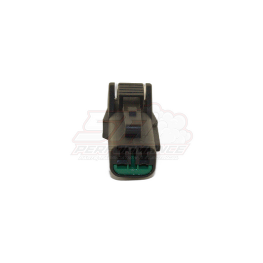 Front view of 2-pin grey Nissan vehicle speed sensor connector showing black housing with green terminal lock and ribbed latch