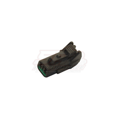 2 pin grey Nissan speed sensor connector angled view showing housing ribs and green terminal seal