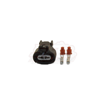 Black 2-pin Toyota Denso push-in connector housing with two metal terminals and orange seals displayed separately