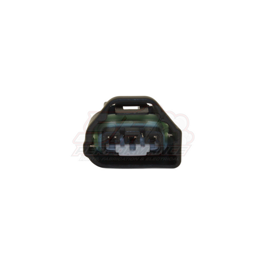 Front view of 3-pin Toyota Mazda TPS throttle position sensor connector showing black housing with green wire seal and three terminal pins