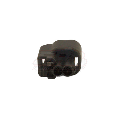 Black plastic 2-pin US car plug connector housing shown from side angle with terminal cavities and locking tabs visible